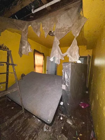 a bathroom with a sink vanity mirror and toilet