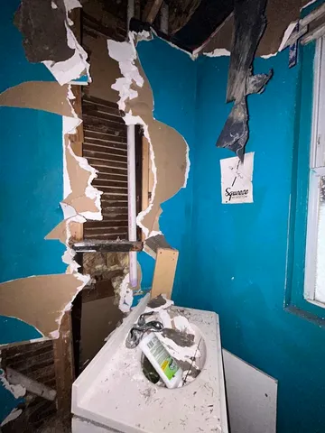 a bathroom with a bathtub and shower