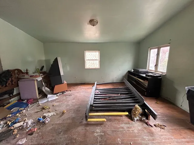 a view of workspace with wooden floor windows