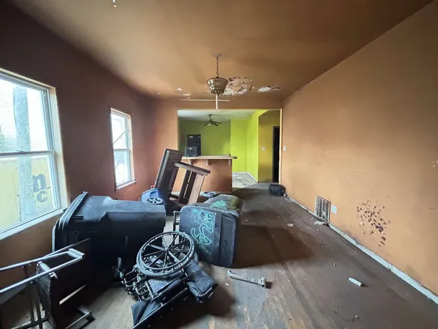 a view of wooden floor and windows in a room