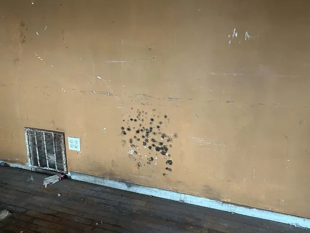 a view of a room with a hanging light