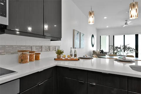 a kitchen with a sink and cabinets