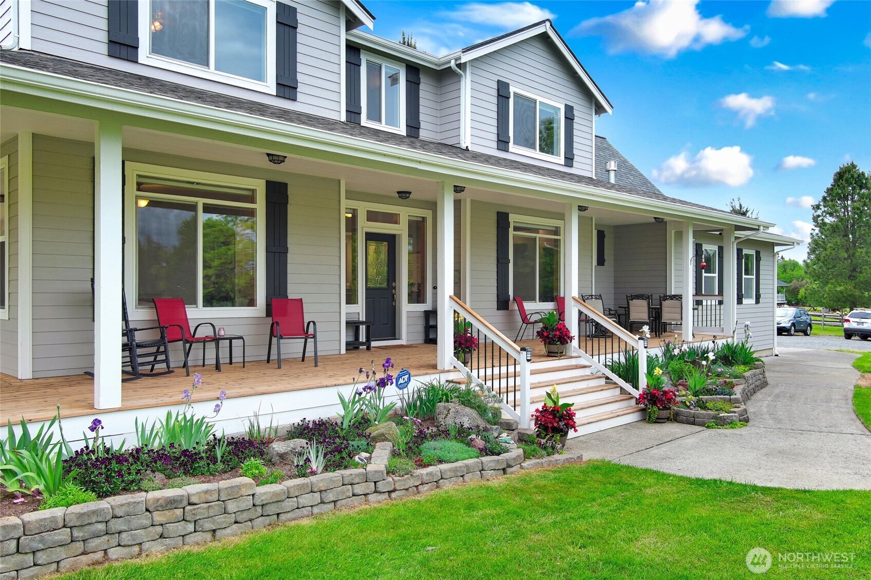14419 Martinson Road Southeast Yelm, WA 98597 - Photo 5 of 39 a view of a house with sitting area and garden