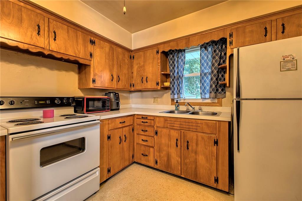 1119 Church Street Indiana, PA 15701 - Photo 11 of 34 a kitchen with stainless steel appliances granite countertop a refrigerator and a sink
