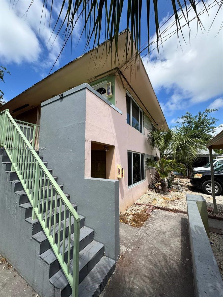 265 Northeast 55th Terrace, Unit 1 Miami, FL 33137 - Photo 2 of 3 a view of a house with a yard