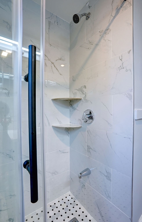 23 Langley Circle, Unit 1 Quincy, MA 02170 - Photo 21 of 27 a bathroom with a shower