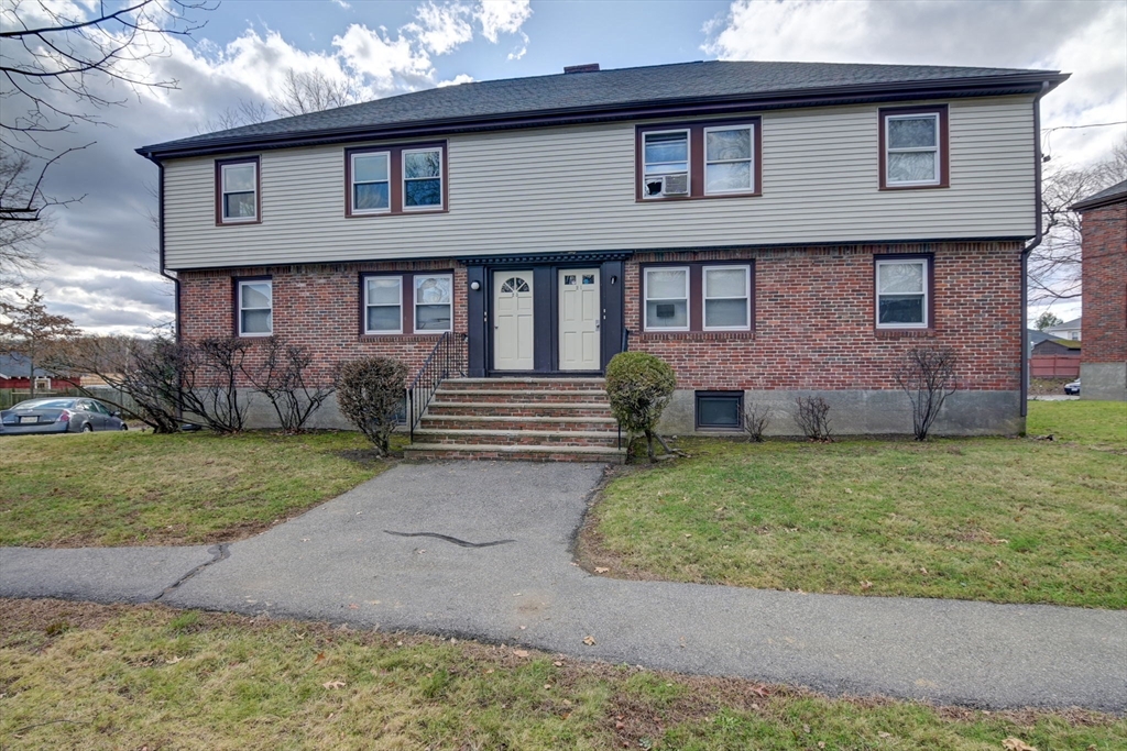 23 Langley Circle, Unit 1 Quincy, MA 02170 - Photo 26 of 27 a front view of a house with garden