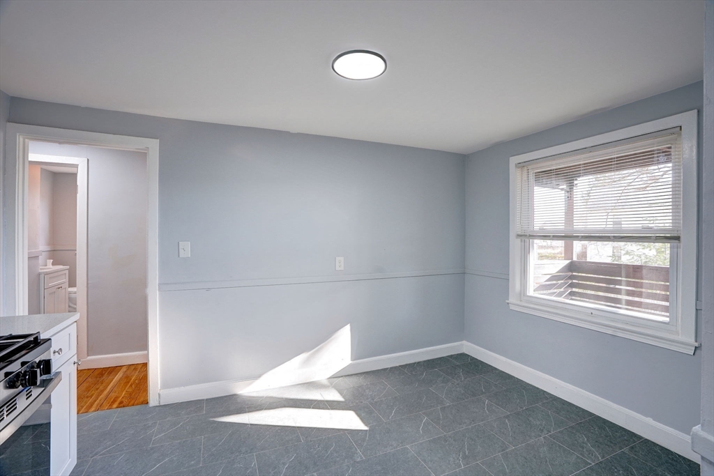 23 Langley Circle, Unit 1 Quincy, MA 02170 - Photo 4 of 27 a view of a livingroom with a window