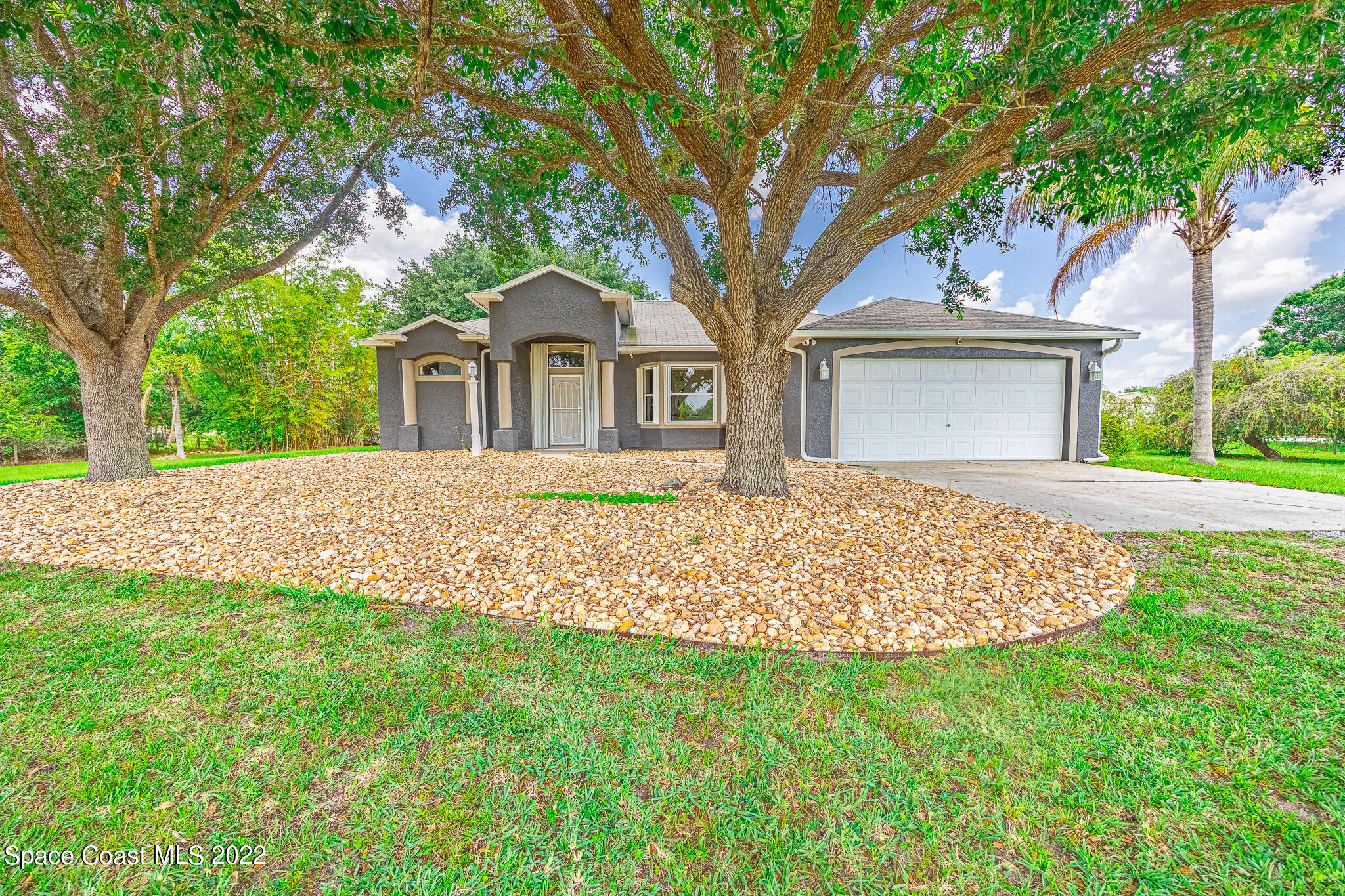 2030 Weber Road Malabar, FL 32950 - Photo 1 of 41 front view of a house with a yard