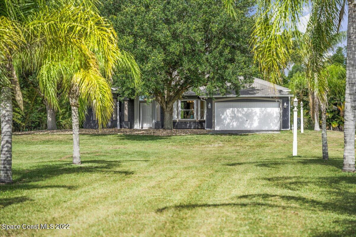 2030 Weber Road Malabar, FL 32950 - Photo 2 of 41 a view of a house with a yard
