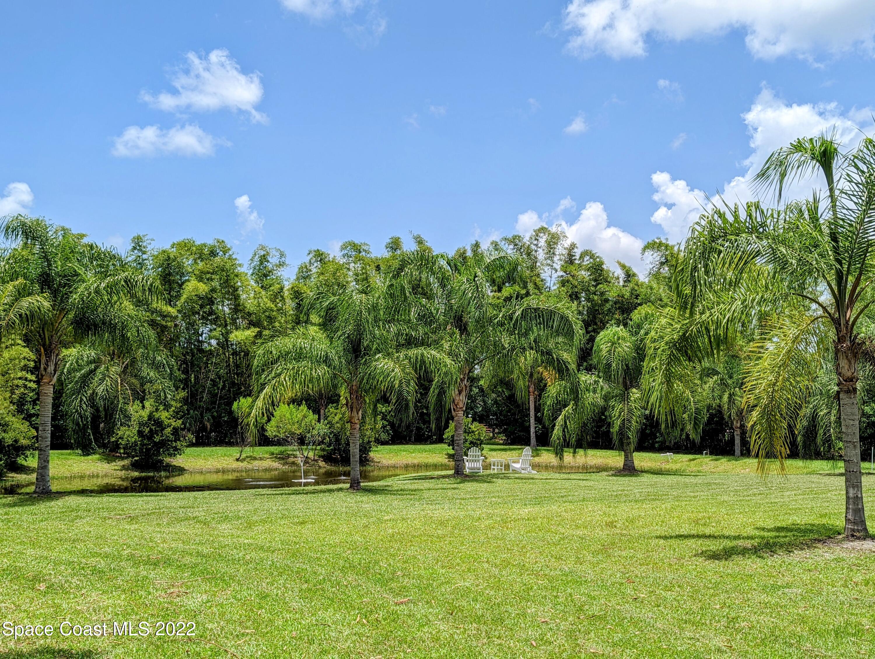 2030 Weber Road Malabar, FL 32950 - Photo 22 of 41 a front view of a house with a big yard