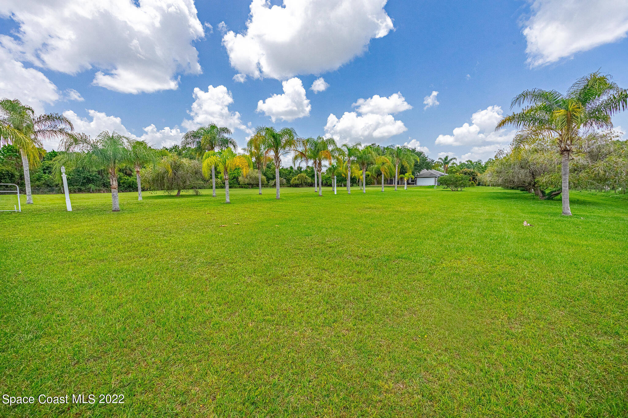 2030 Weber Road Malabar, FL 32950 - Photo 31 of 41 a view of a golf course with a big yard