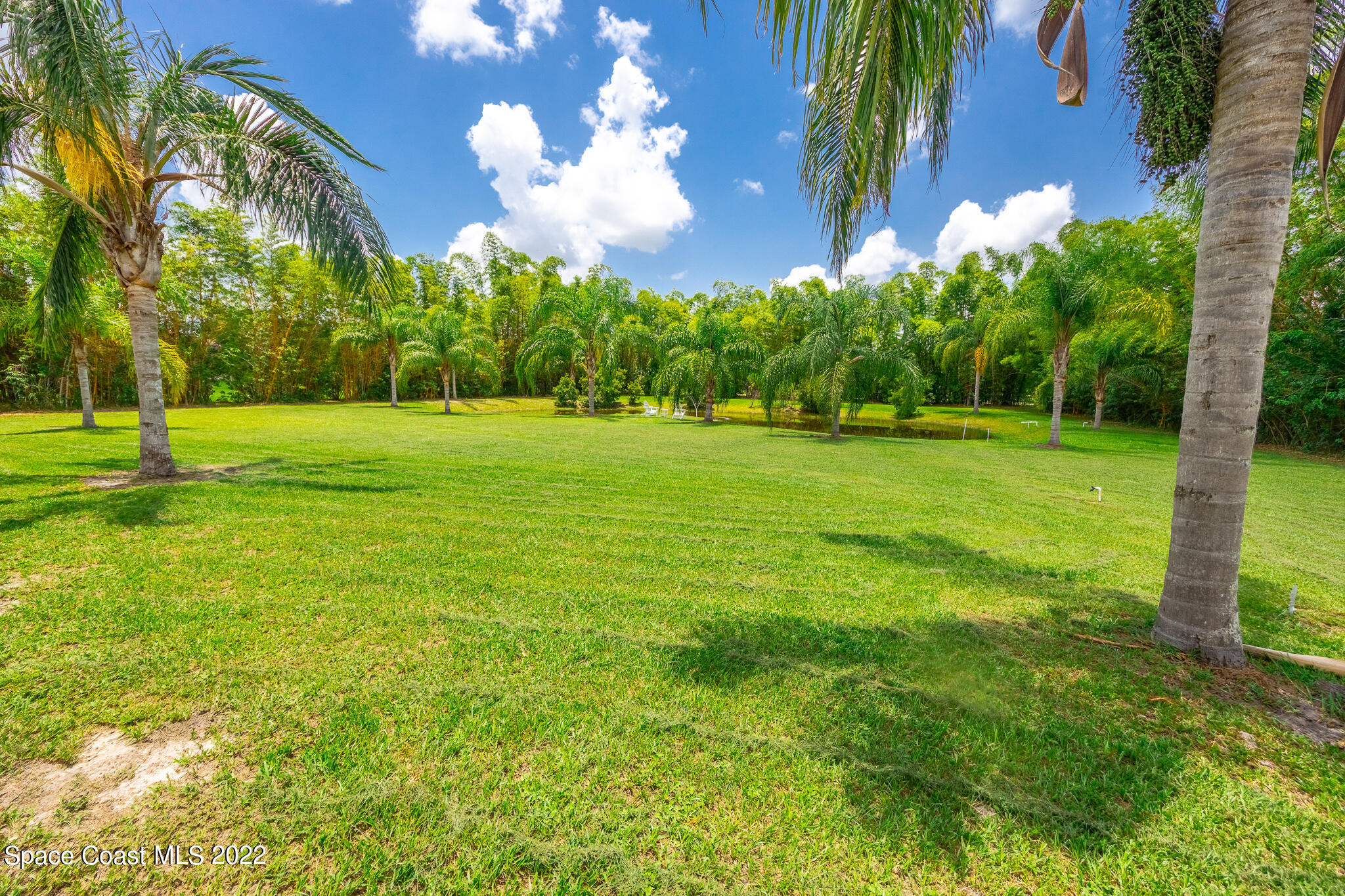 2030 Weber Road Malabar, FL 32950 - Photo 34 of 41 a view of a golf course with a house