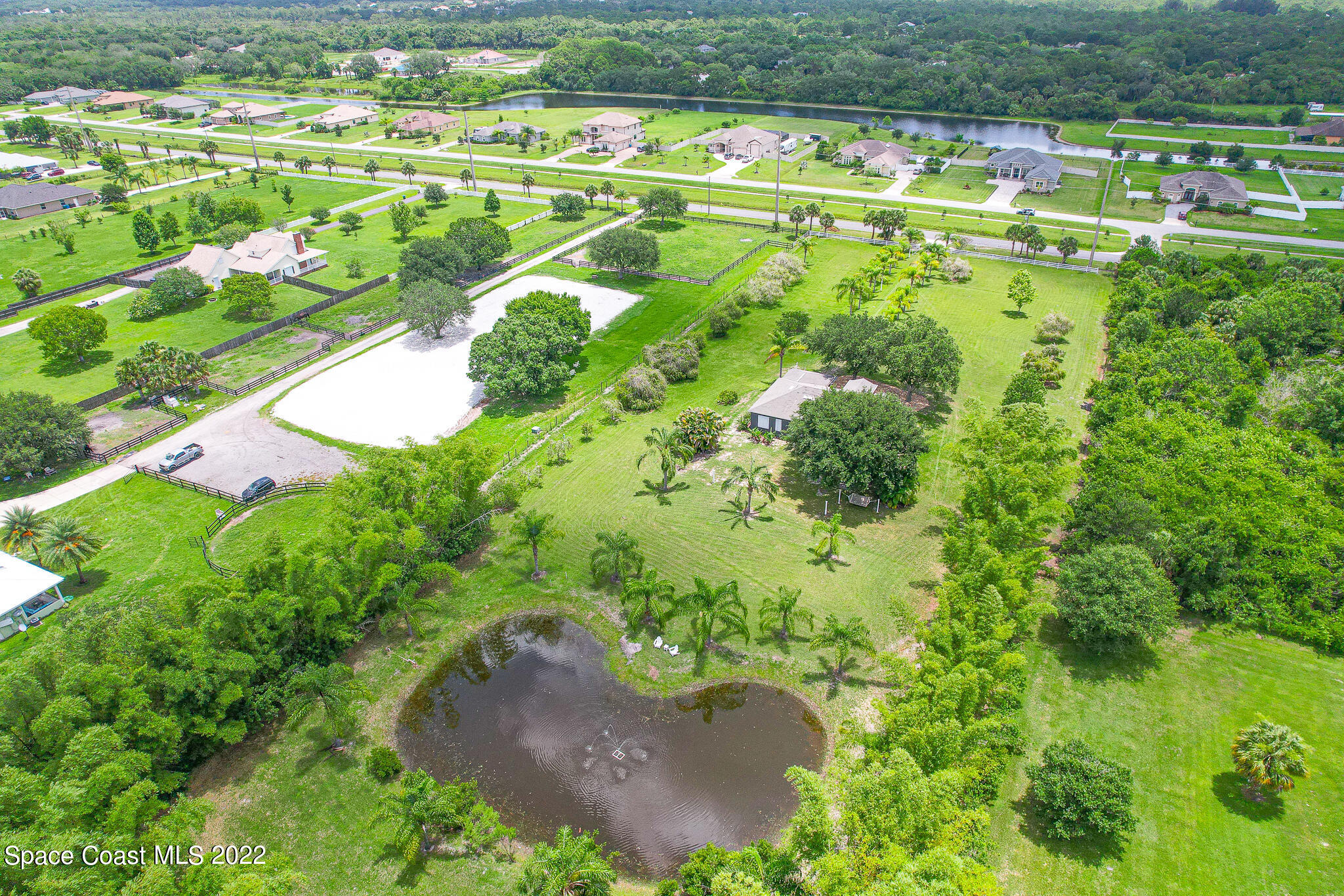2030 Weber Road Malabar, FL 32950 - Photo 39 of 41 a view of a swimming pool with a yard