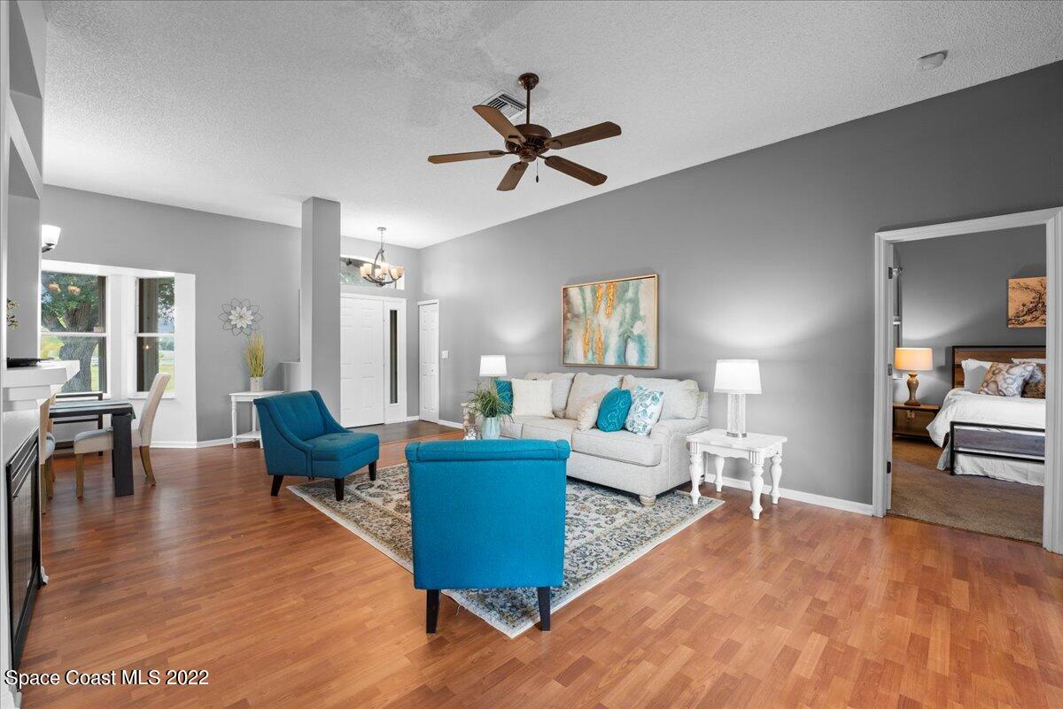 2030 Weber Road Malabar, FL 32950 - Photo 5 of 41 a living room with furniture and a wooden floor