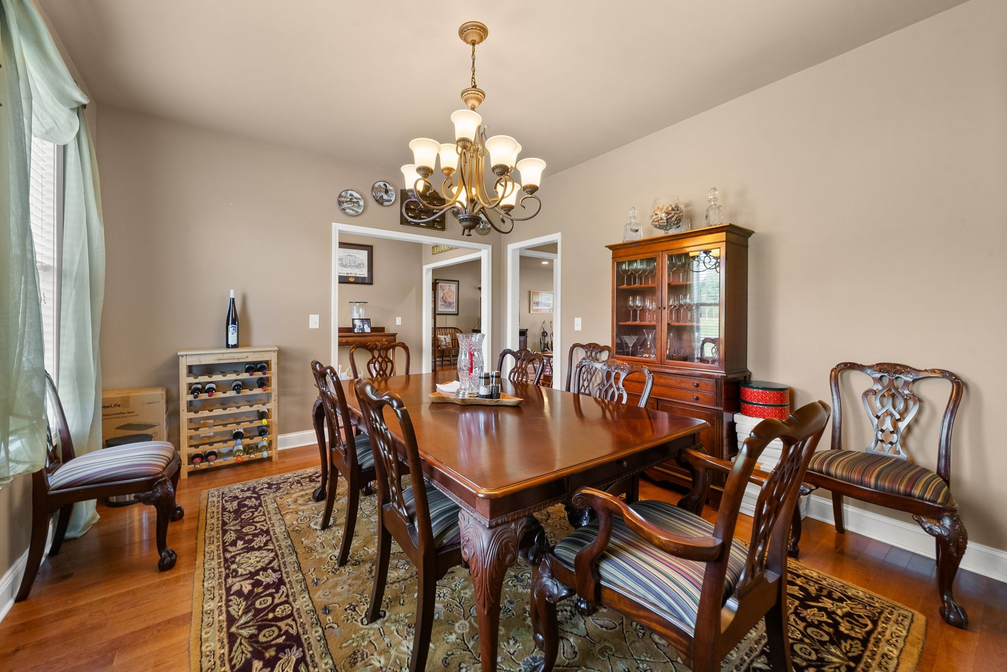 4940 Marion Road Cunningham, TN 37052 - Photo 6 of 43 a view of a dining room with furniture a chandelier and wooden floor