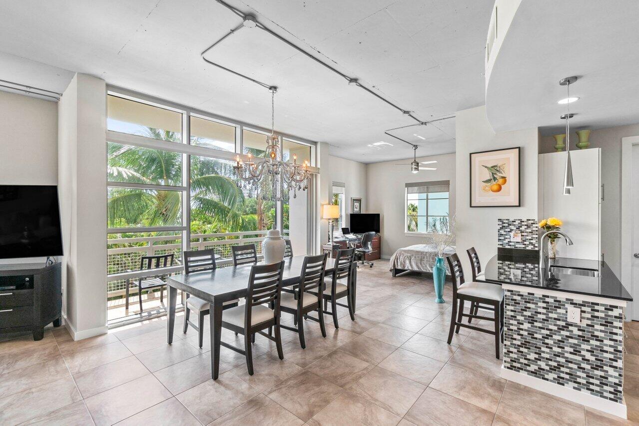 335 Southeast 6th Avenue, Unit 304 Delray Beach, FL 33483 - Photo 15 of 37 a view of a livingroom with furniture window and outside view