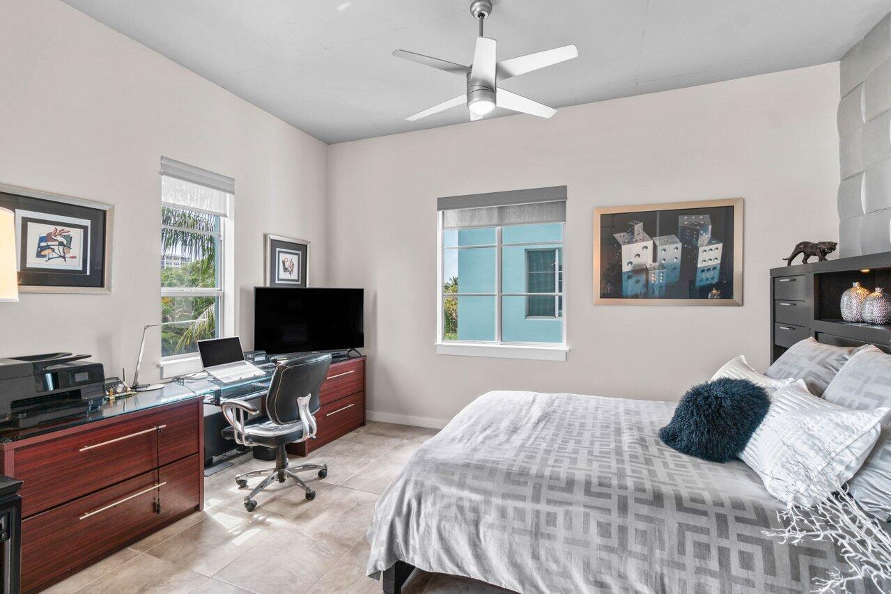 335 Southeast 6th Avenue, Unit 304 Delray Beach, FL 33483 - Photo 9 of 37 a bedroom with a workspace