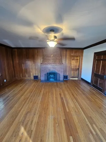 a view of a room with a wooden floor