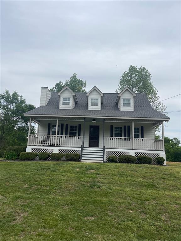 126 Findley Road Rydal, GA 30171 - Photo 1 of 4 a front view of a house with a garden