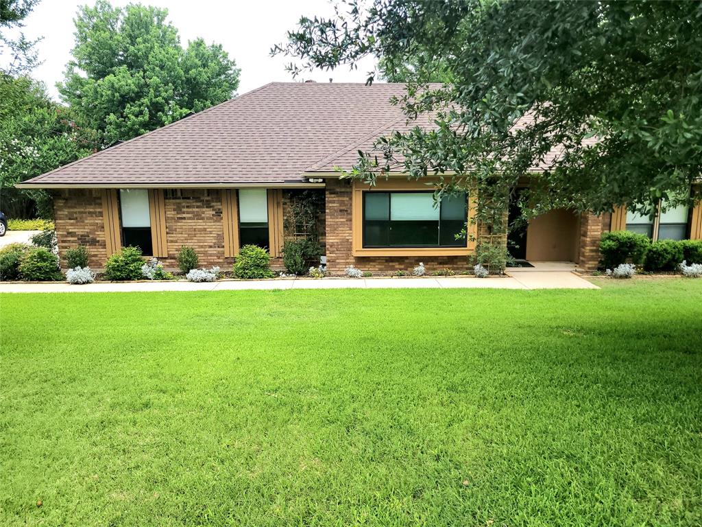 912 North Dove Road Grapevine, TX 76051 - Photo 1 of 36 a front view of house with yard and green space