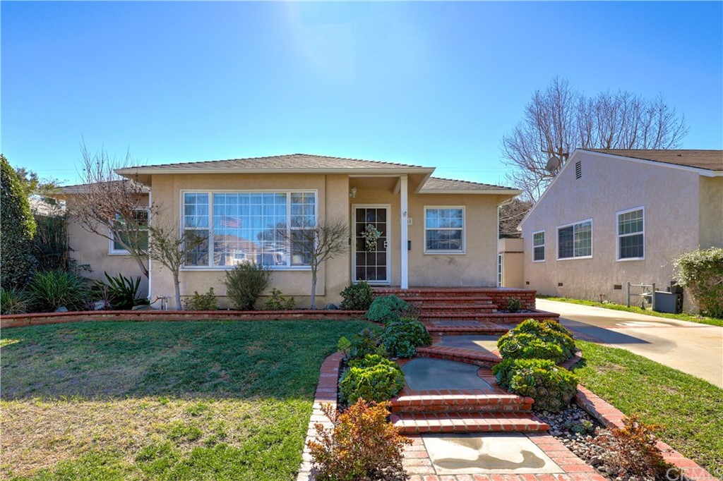 6108 Freckles Road Lakewood, CA 90713 - Photo 1 of 1 a front view of a house with garden