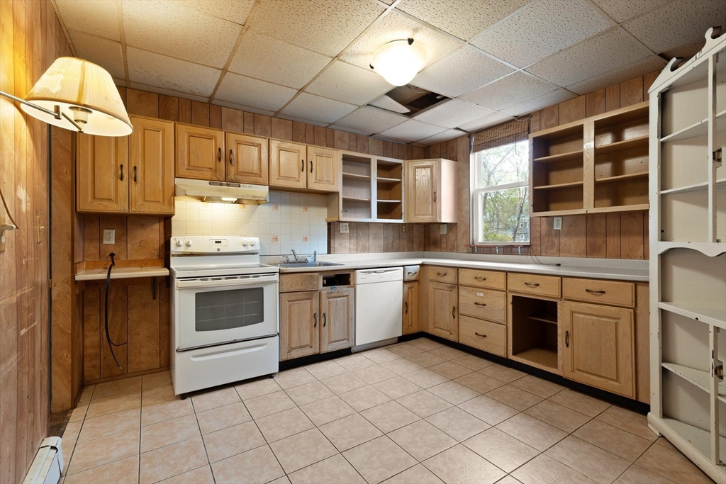 68 Murdock Street Boston, MA 02135 - Photo 13 of 35 a kitchen with stainless steel appliances granite countertop a stove sink and cabinets