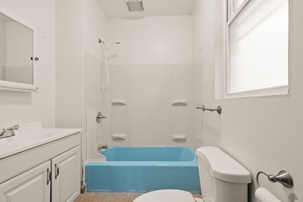 68 Murdock Street Boston, MA 02135 - Photo 14 of 35 a bathroom with a sink and a mirror