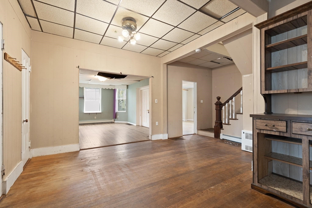 68 Murdock Street Boston, MA 02135 - Photo 15 of 35 a view of an empty room with a fireplace and a window