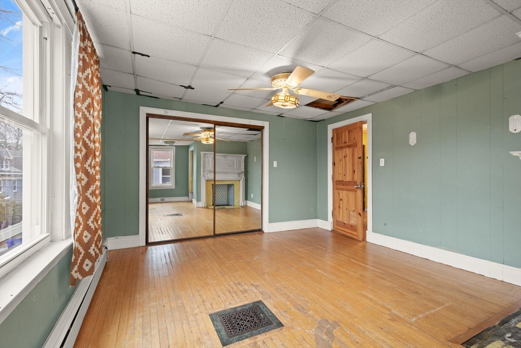 68 Murdock Street Boston, MA 02135 - Photo 20 of 35 a view of an empty room with window and wooden floor