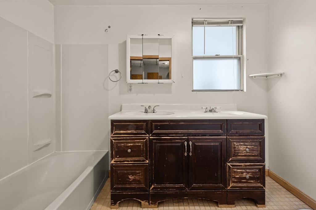 68 Murdock Street Boston, MA 02135 - Photo 24 of 35 a bathroom with a sink and a mirror