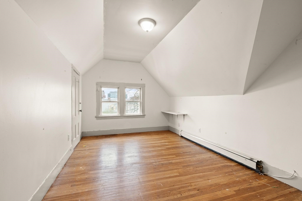 68 Murdock Street Boston, MA 02135 - Photo 27 of 35 wooden floor in an empty room with a window