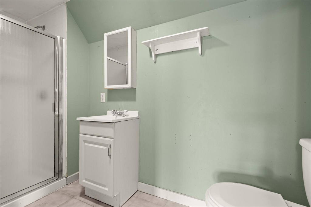 68 Murdock Street Boston, MA 02135 - Photo 28 of 35 a bathroom with a toilet a sink and mirror