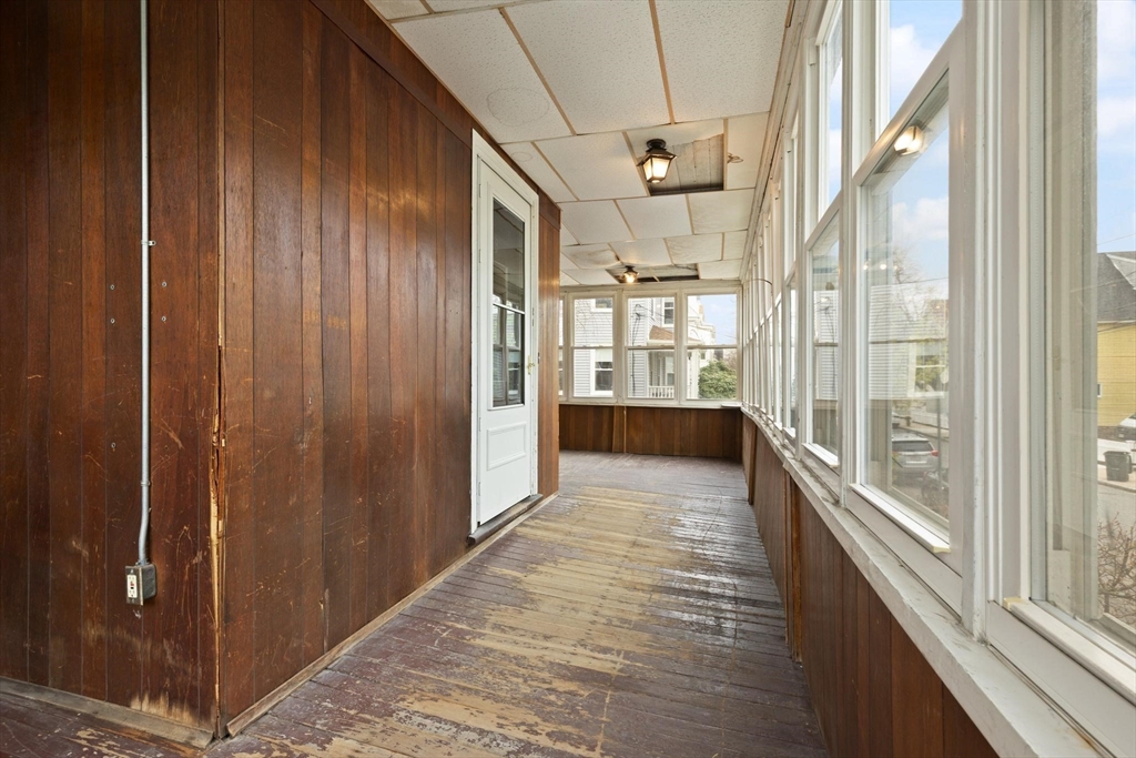 68 Murdock Street Boston, MA 02135 - Photo 6 of 35 a view of a hallway with wooden floor and windows