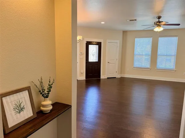 a view of an entryway with wooden floor