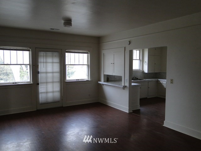 3890 Upton Road Prescott, WA 99348 - Photo 11 of 31 an empty room with wooden floor and windows