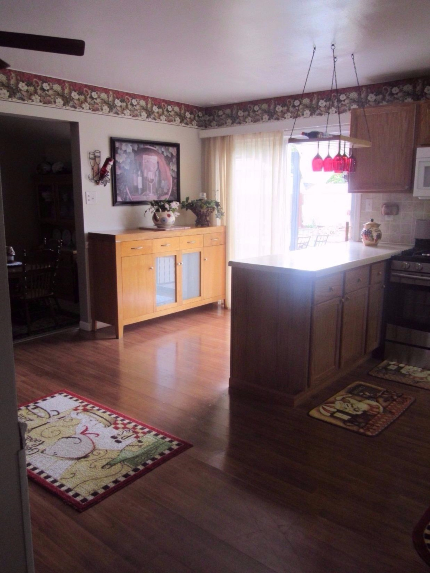 755-1 Governor Road Valparaiso, IN 46385 - Photo 5 of 10 a kitchen with granite countertop a stove a sink and a refrigerator