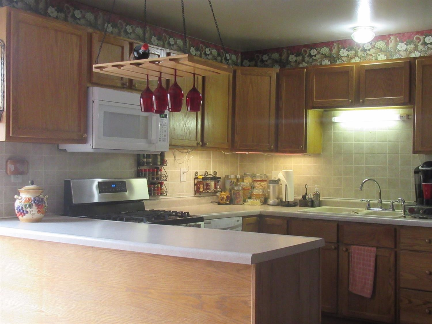 755-1 Governor Road Valparaiso, IN 46385 - Photo 8 of 10 a kitchen with a sink a stove and cabinets
