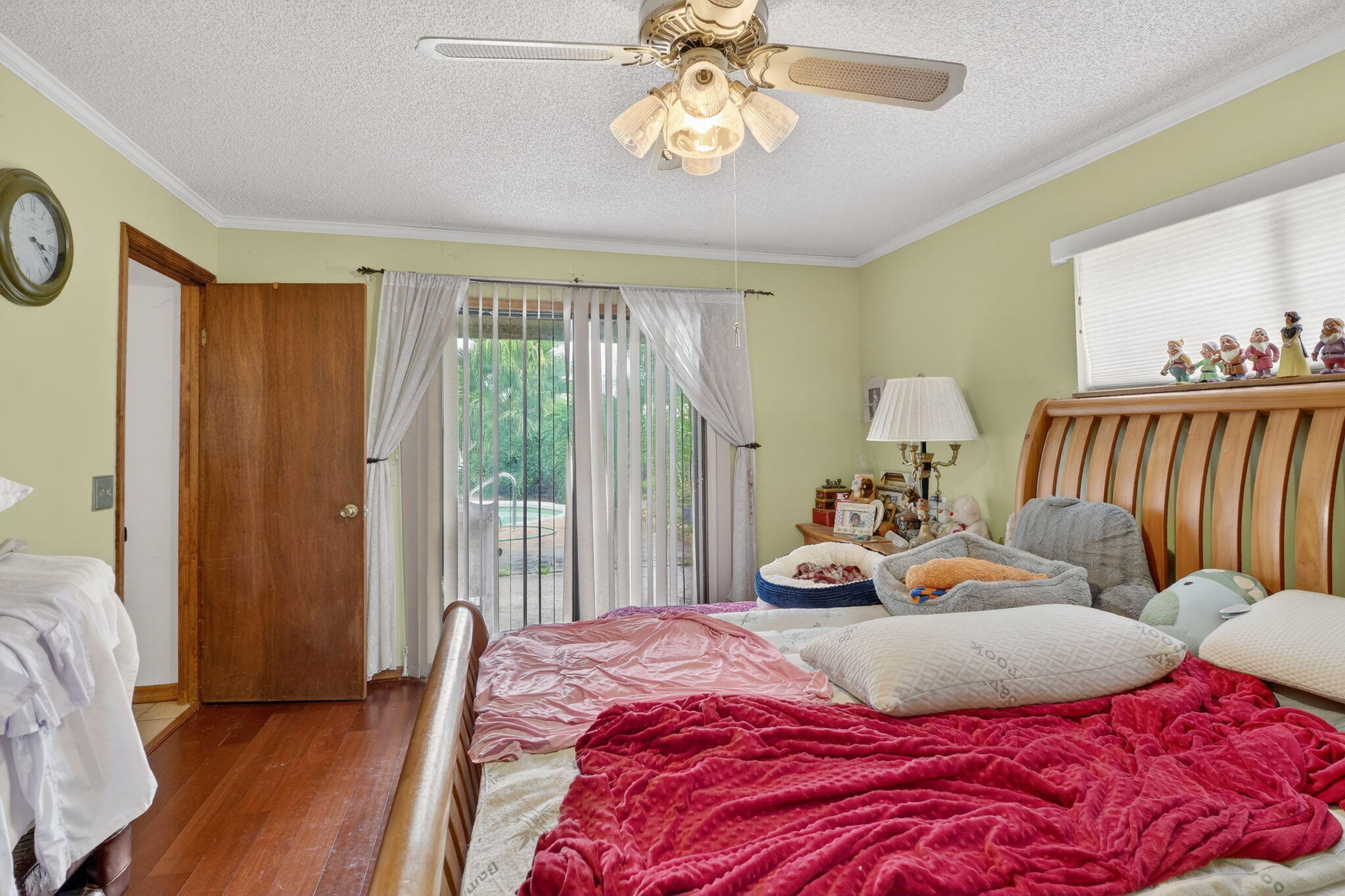 3133 Fairview Drive Melbourne, FL 32934 - Photo 13 of 45 a bedroom with bed and wooden floor