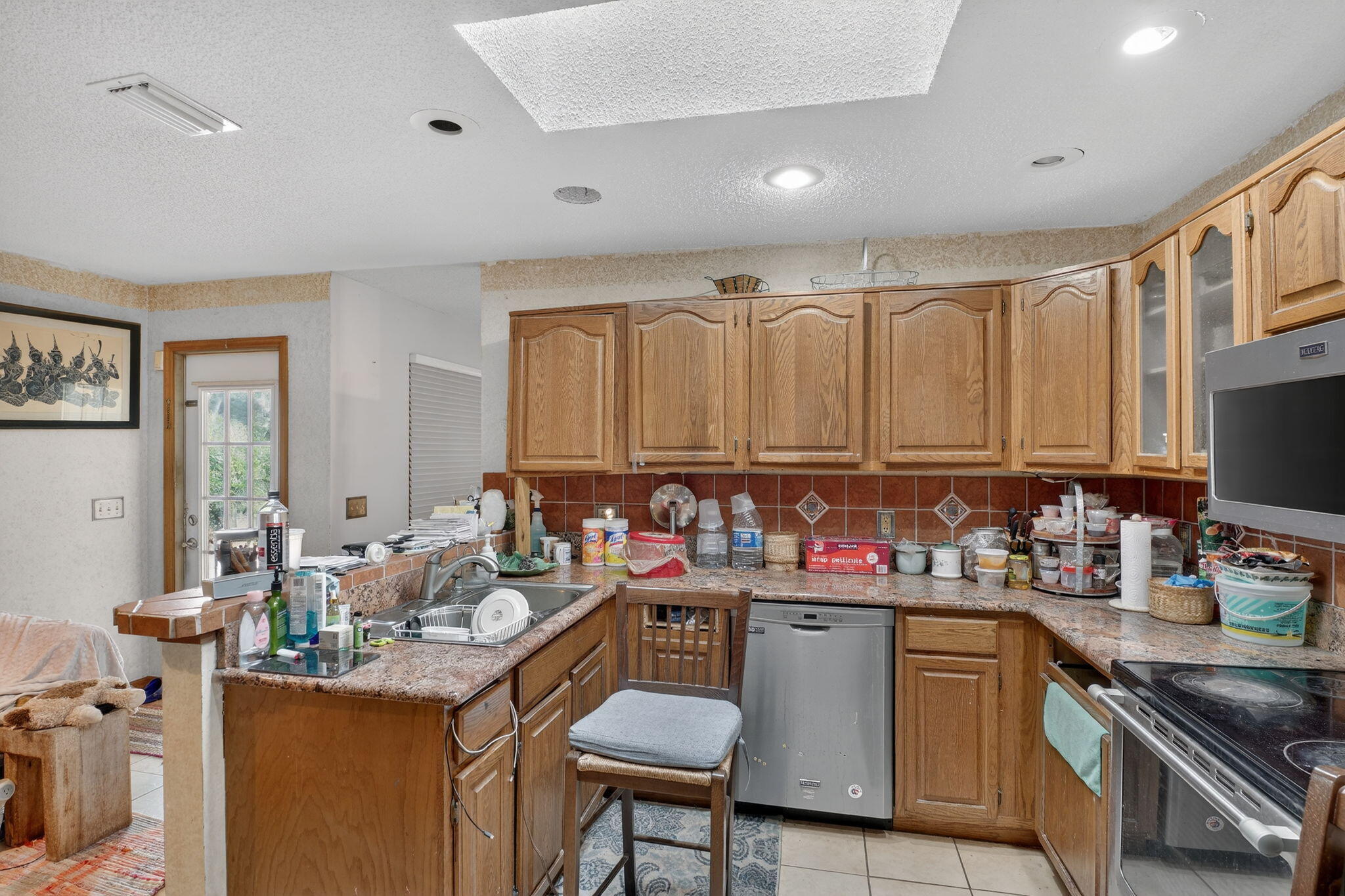 3133 Fairview Drive Melbourne, FL 32934 - Photo 19 of 45 a kitchen with a stove a sink and a refrigerator
