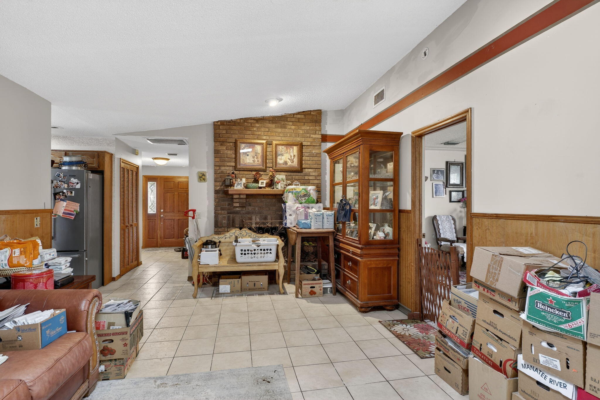 3133 Fairview Drive Melbourne, FL 32934 - Photo 22 of 45 a living room with furniture and cabinets
