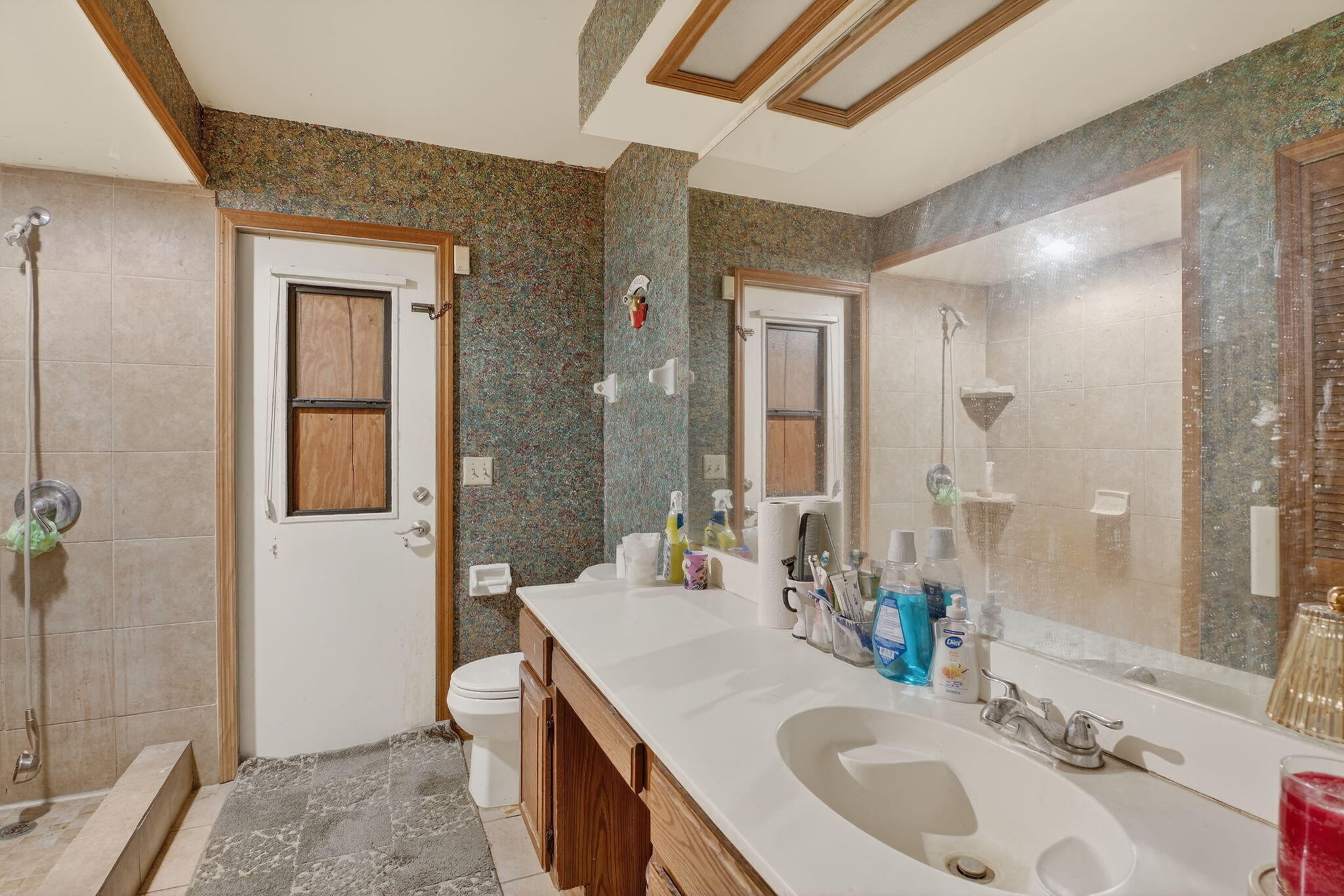 3133 Fairview Drive Melbourne, FL 32934 - Photo 25 of 45 a bathroom with a sink a toilet and shower