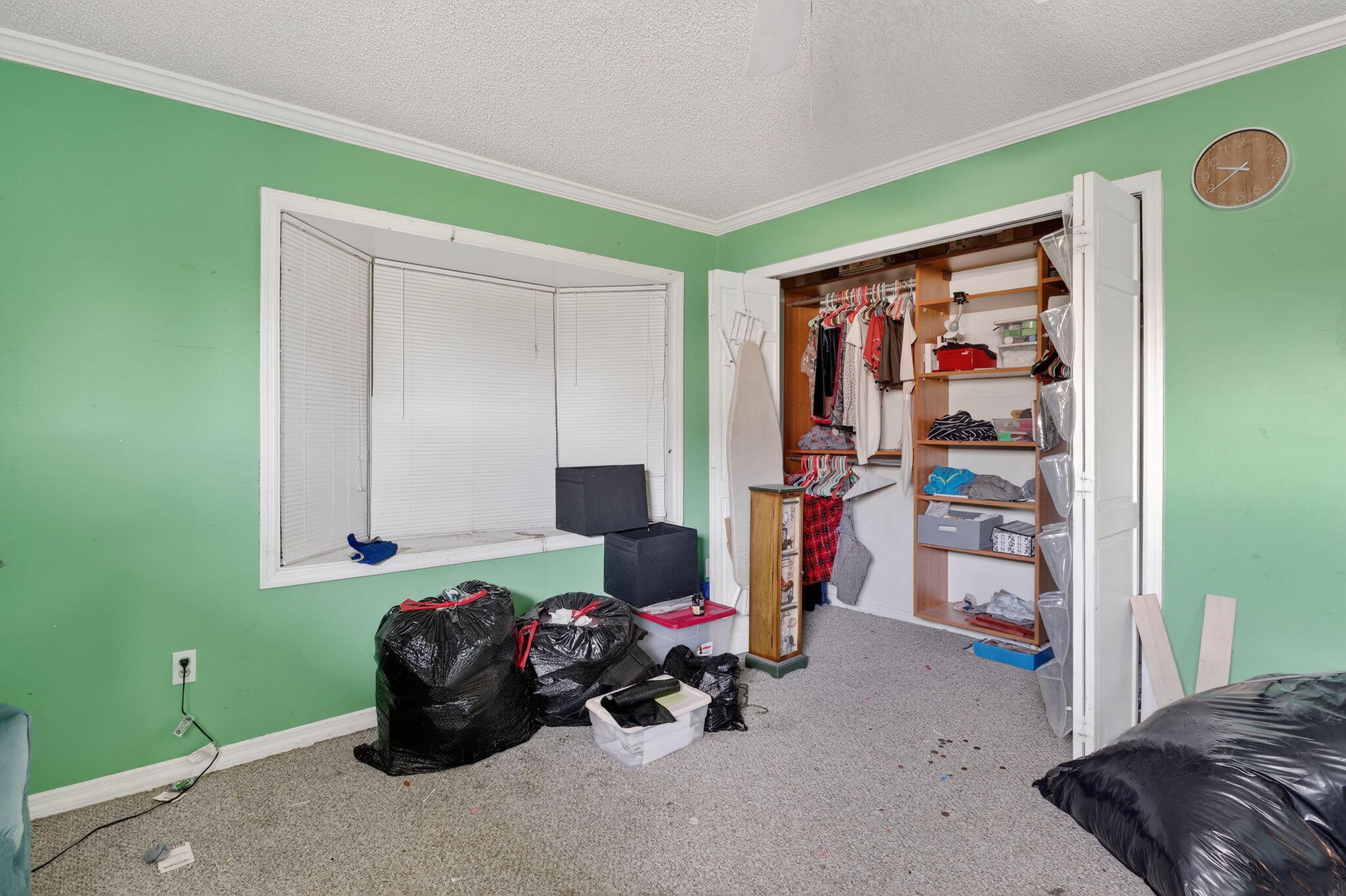 3133 Fairview Drive Melbourne, FL 32934 - Photo 29 of 45 a bedroom with furniture and a fan