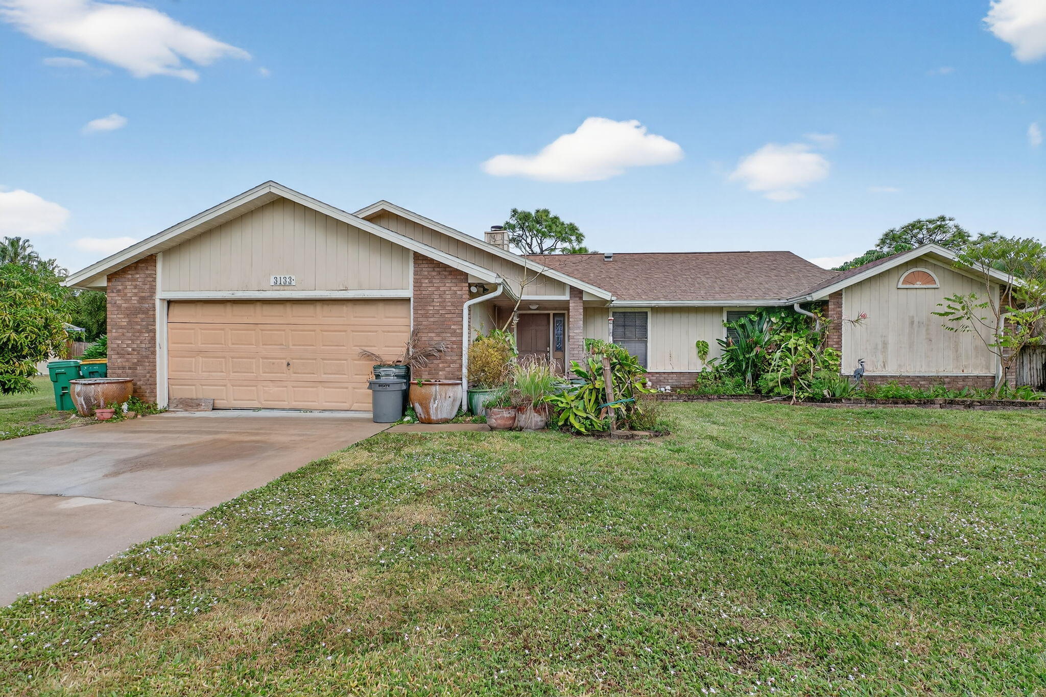 3133 Fairview Drive Melbourne, FL 32934 - Photo 3 of 45 a view of a house with a yard and plants