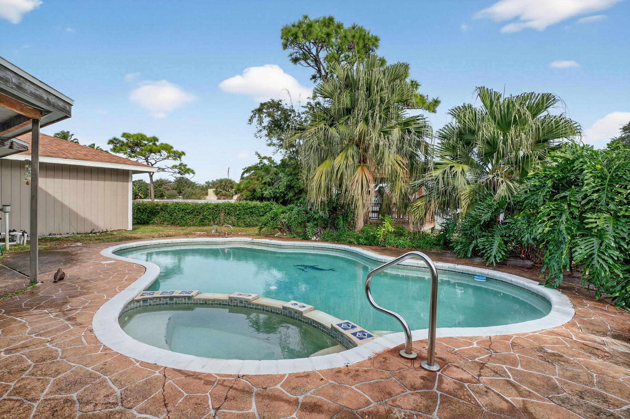 3133 Fairview Drive Melbourne, FL 32934 - Photo 32 of 45 a view of a backyard with a tub and chair