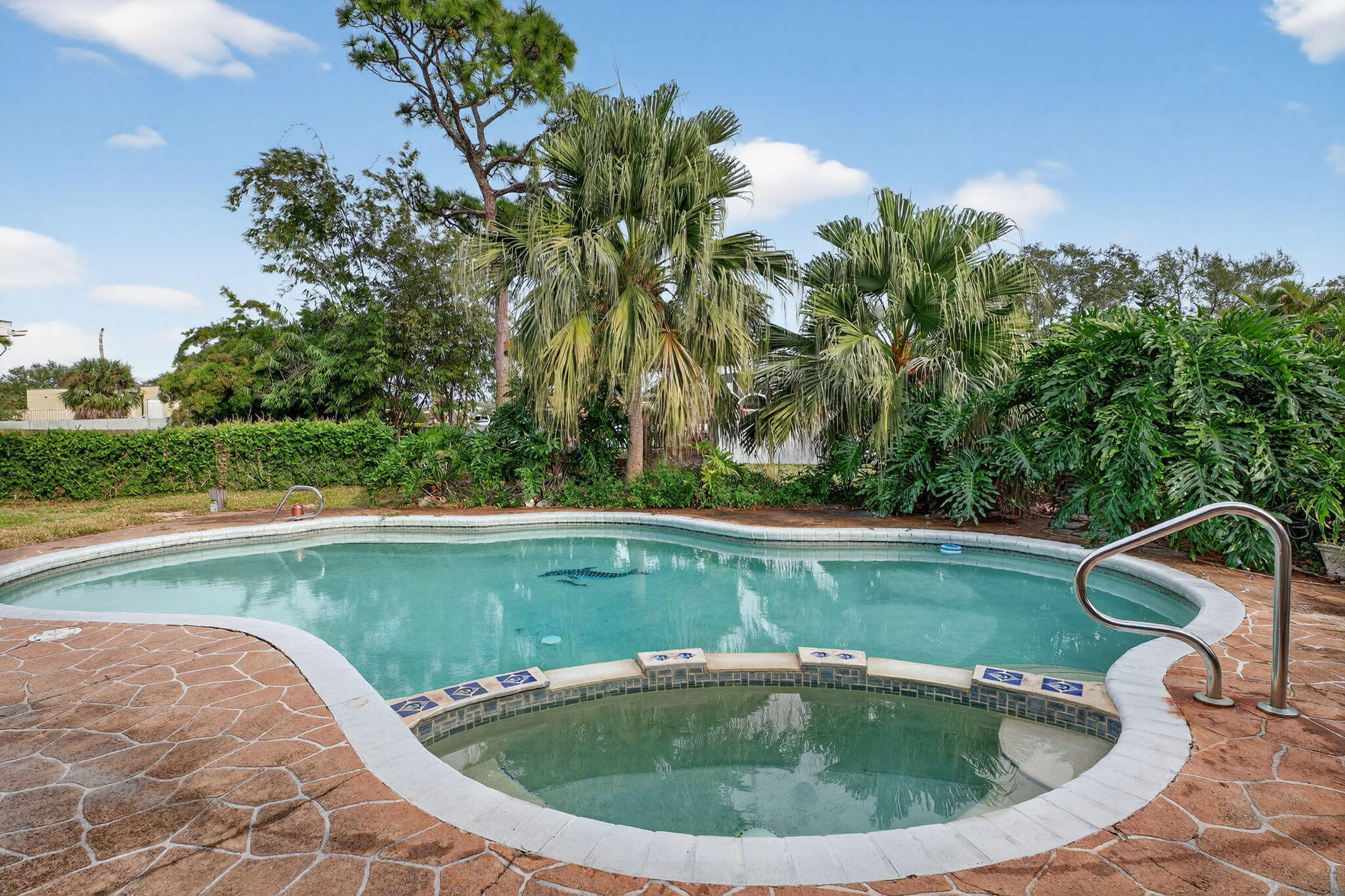 3133 Fairview Drive Melbourne, FL 32934 - Photo 33 of 45 a view of a swimming pool with a yard