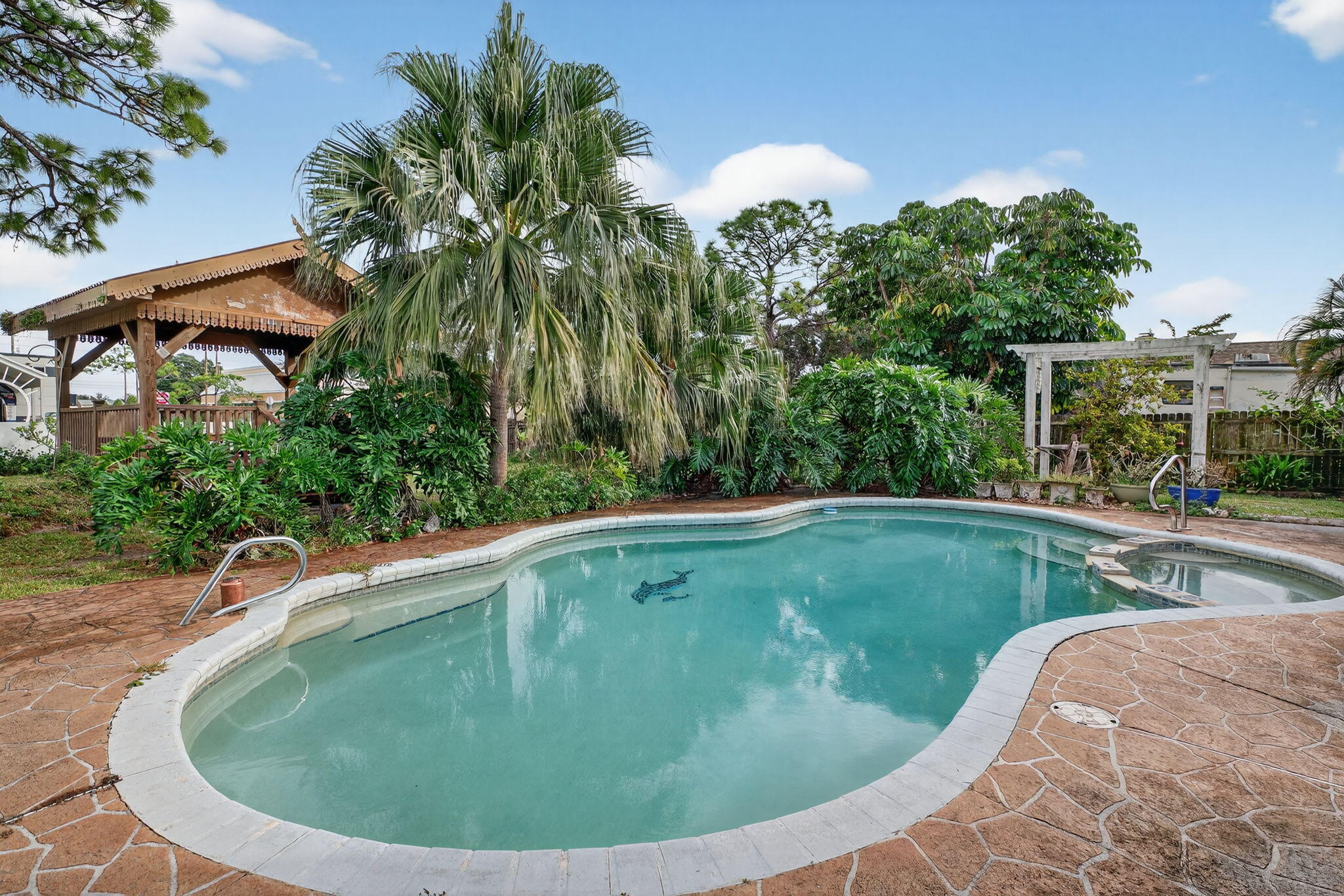 3133 Fairview Drive Melbourne, FL 32934 - Photo 34 of 45 a view of a swimming pool with a yard