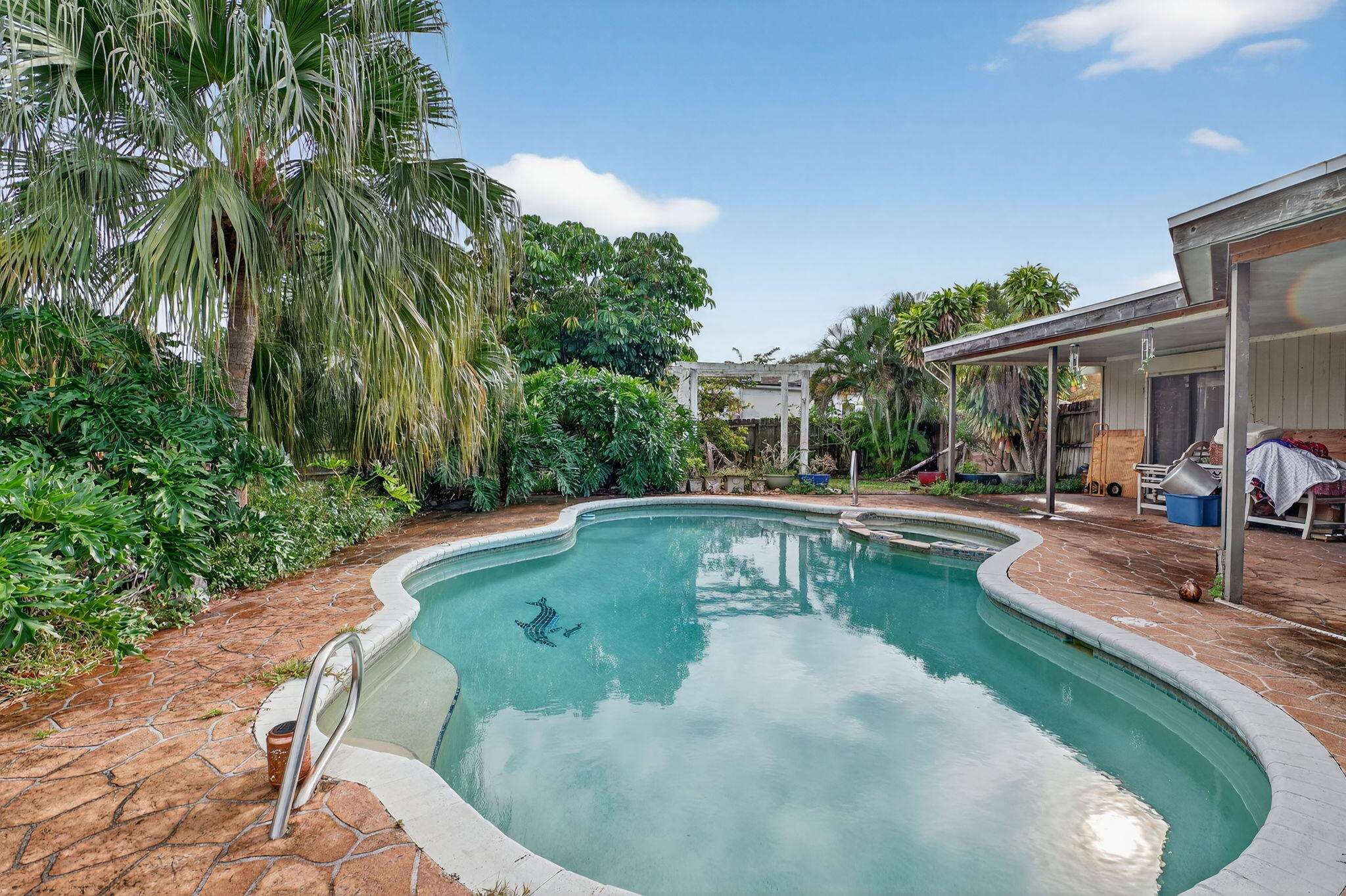 3133 Fairview Drive Melbourne, FL 32934 - Photo 35 of 45 a view of a swimming pool with a patio