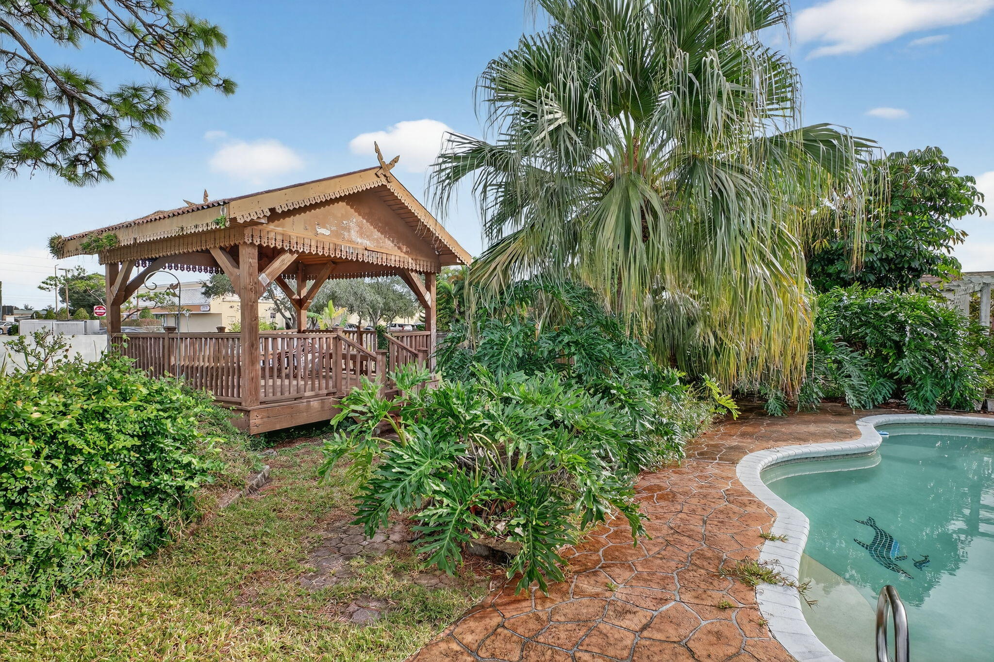 3133 Fairview Drive Melbourne, FL 32934 - Photo 36 of 45 a view of a chair and table in the garden