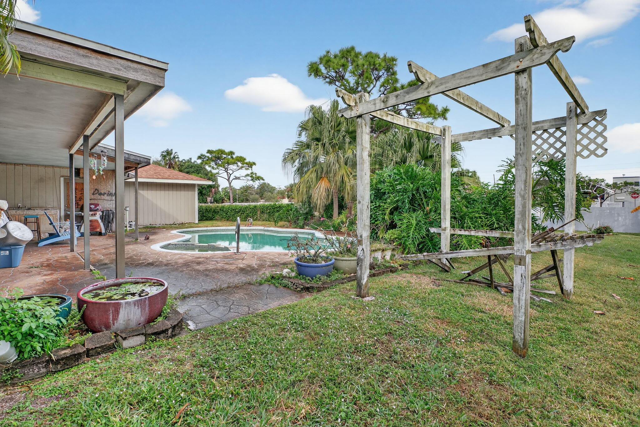 3133 Fairview Drive Melbourne, FL 32934 - Photo 43 of 45 a view of a backyard with table and chairs